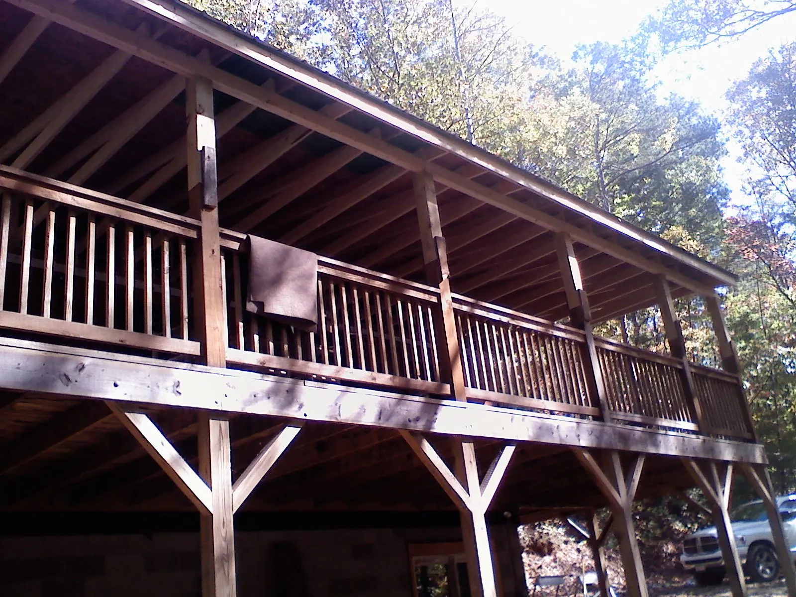 Timber framing under a new elevated porch and deck — Roof Leak Repair in Oak City by Roofing Brothers